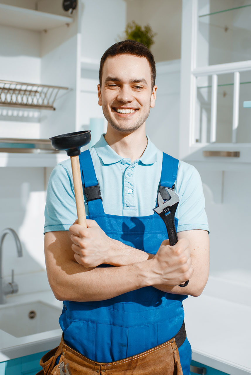 cheerful-male-plumber-holds-wrench-and-plunger-2021-08-28-02-49-30-JXEAURY-b.jpg