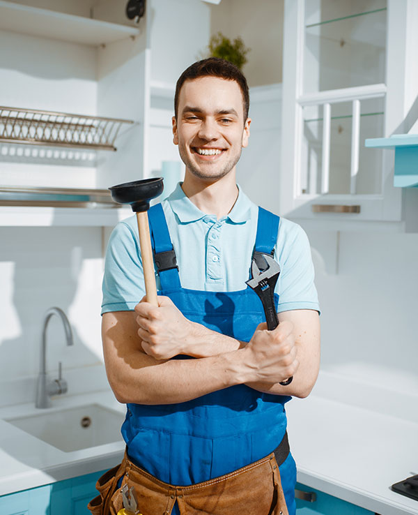cheerful-male-plumber-holds-wrench-and-plunger-2021-08-28-02-49-30-JXEAURY.jpg