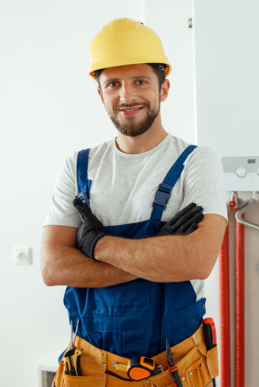 smiling-technician-servicing-the-house-heating-sys-2022-03-07-19-09-26-CEYSWA4-a.jpg